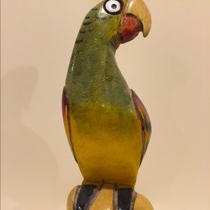 Hand carved and painted wooden parrot on perch